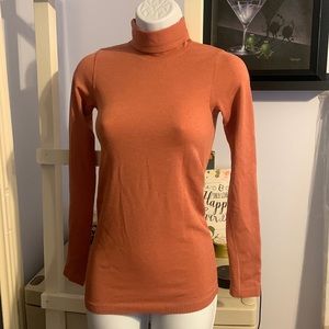 Lululemon turtleneck in a orange color